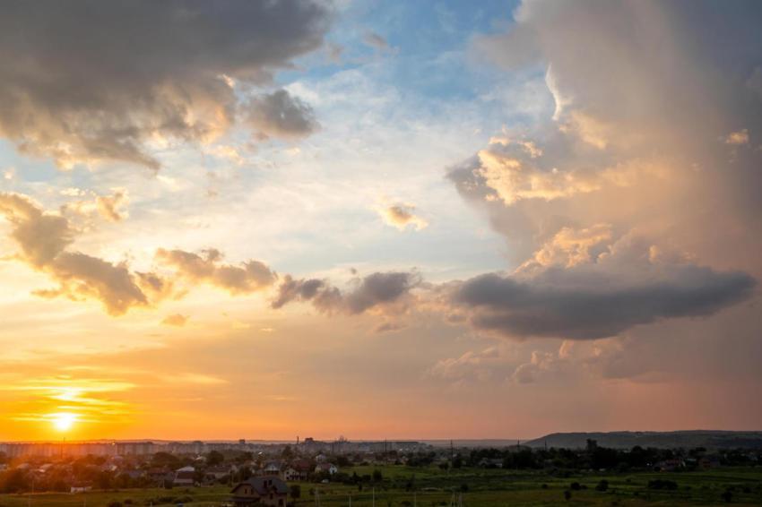 Dramatic sunset rural landscape with puffy clouds 2024 12 06 01 34 32 utc