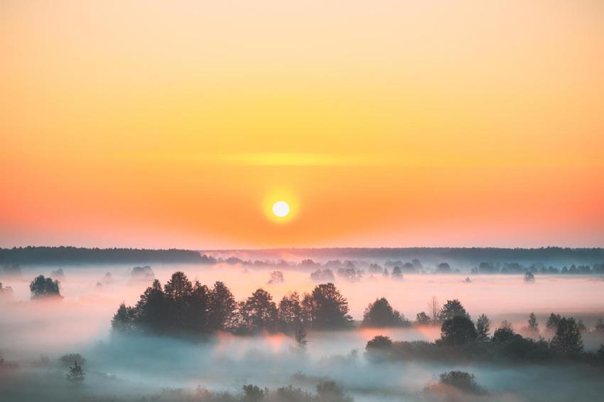 Amazing sunrise sunset over misty landscape sceni 2023 11 27 04 59 22 utc