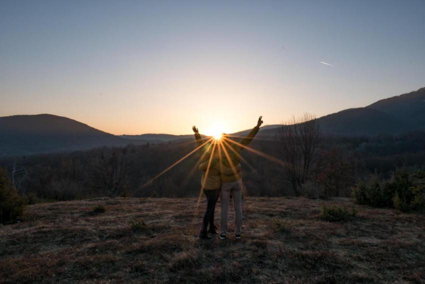 Rear view of young couple with raised arms looking 2023 11 27 05 04 44 utc